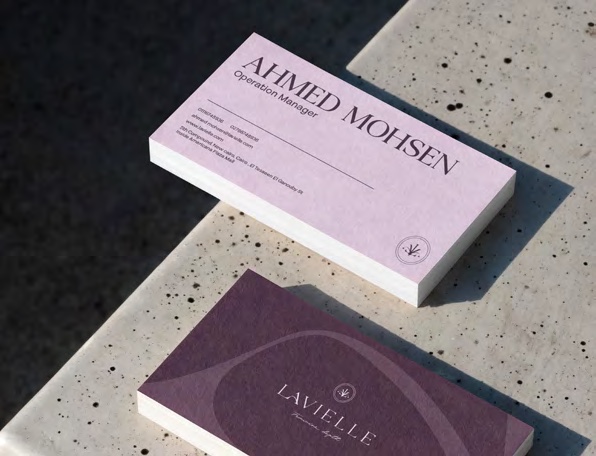 Lavielle business cards arranged on a terrazzo surface